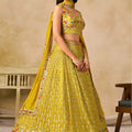 Wonderful Yellow Georgette Lehenga Choli with Floral Zari Embroidery and Matching Dupatta for Wedding