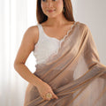 Beige Georgette Saree with Scalloped Border Party Wear Saree