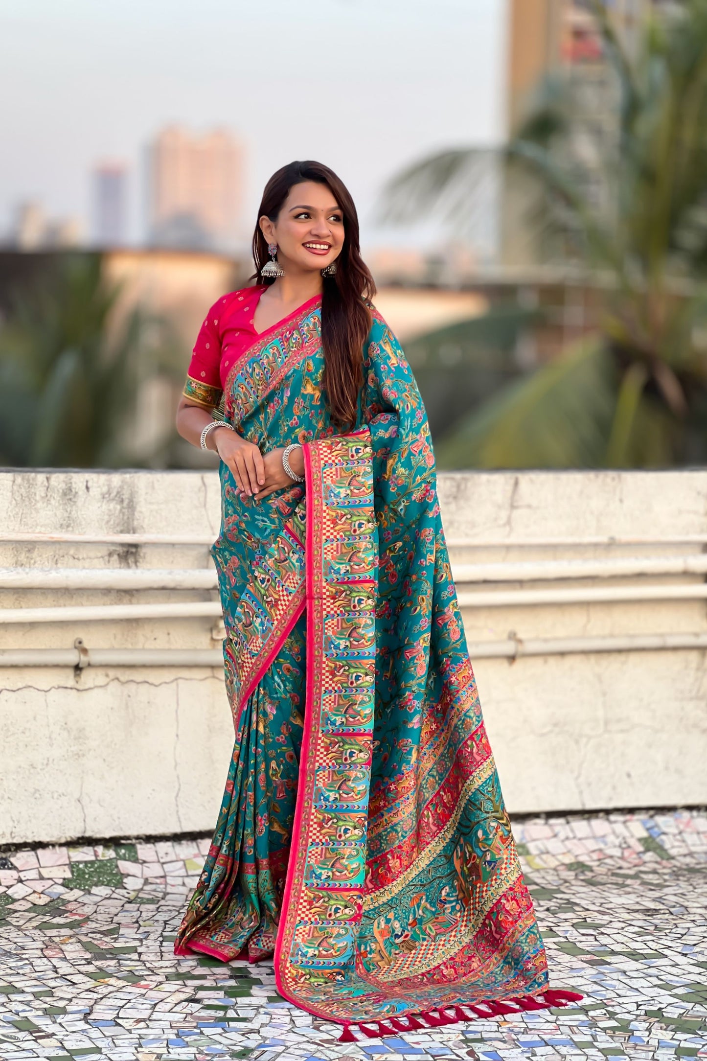Teal Green Printed Silk Saree with Multicolor Traditional Border