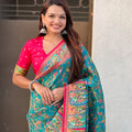 Teal Green Printed Silk Saree with Multicolor Traditional Border
