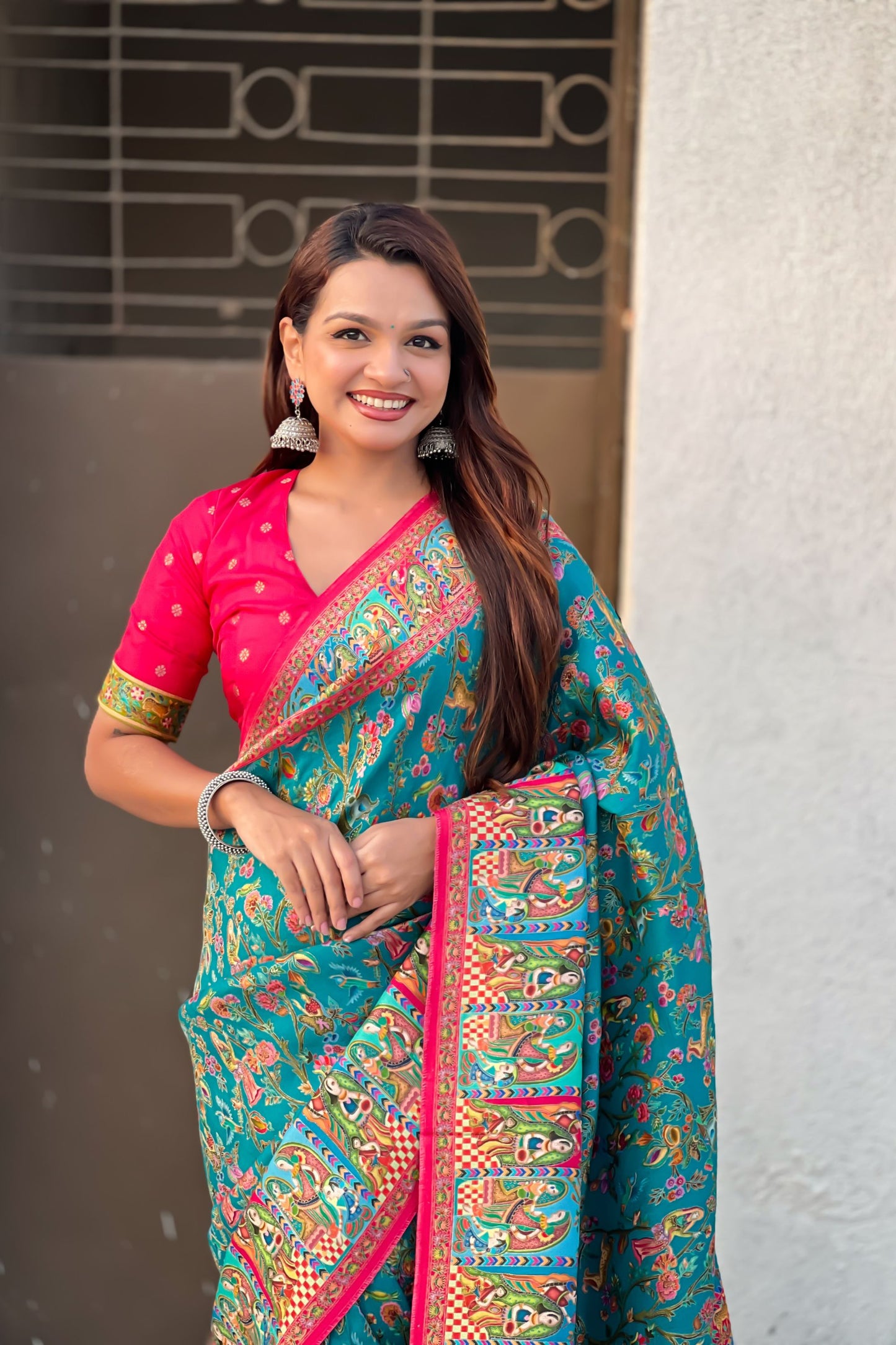 Teal Green Printed Silk Saree with Multicolor Traditional Border