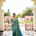 Elegant Teal Green Silk Saree with Gold Zari Stripes Rich Woven Border