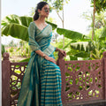 Elegant Teal Green Silk Saree with Gold Zari Stripes Rich Woven Border