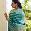 Elegant Teal Green Silk Saree with Gold Zari Stripes Rich Woven Border