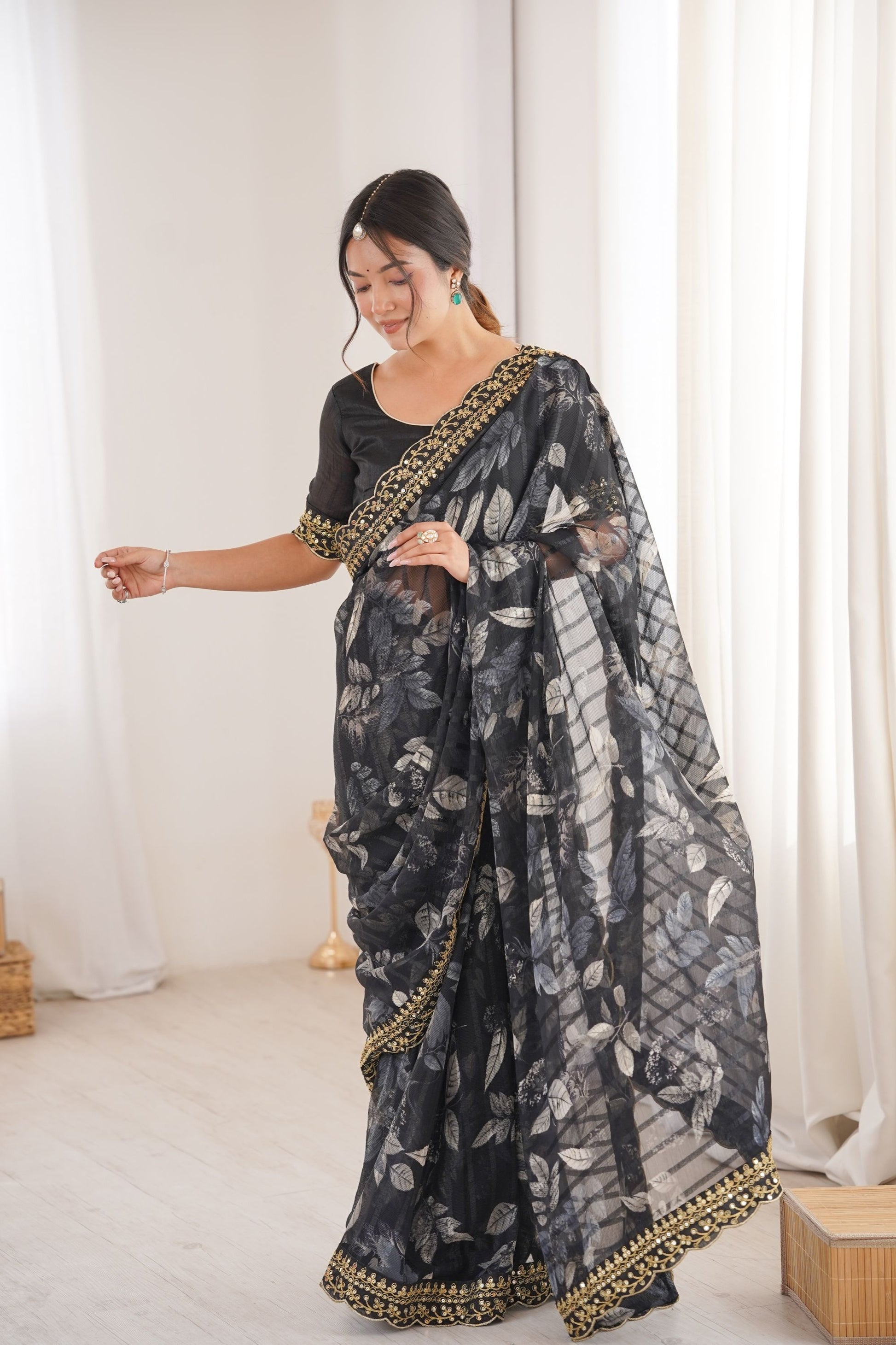 Black Georgette Saree with Golden Embroidered Border Leaf Print