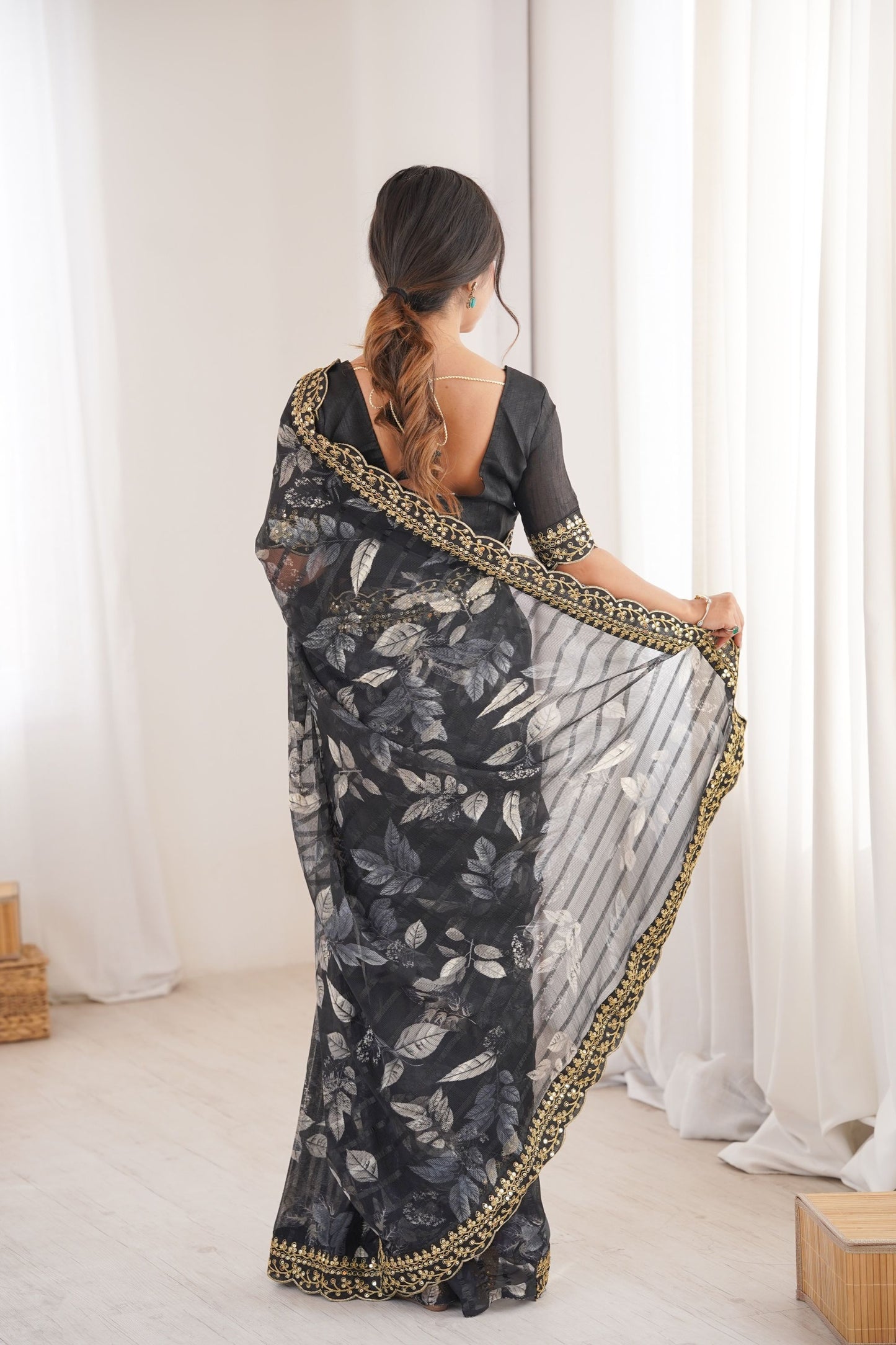 Black Georgette Saree with Golden Embroidered Border Leaf Print