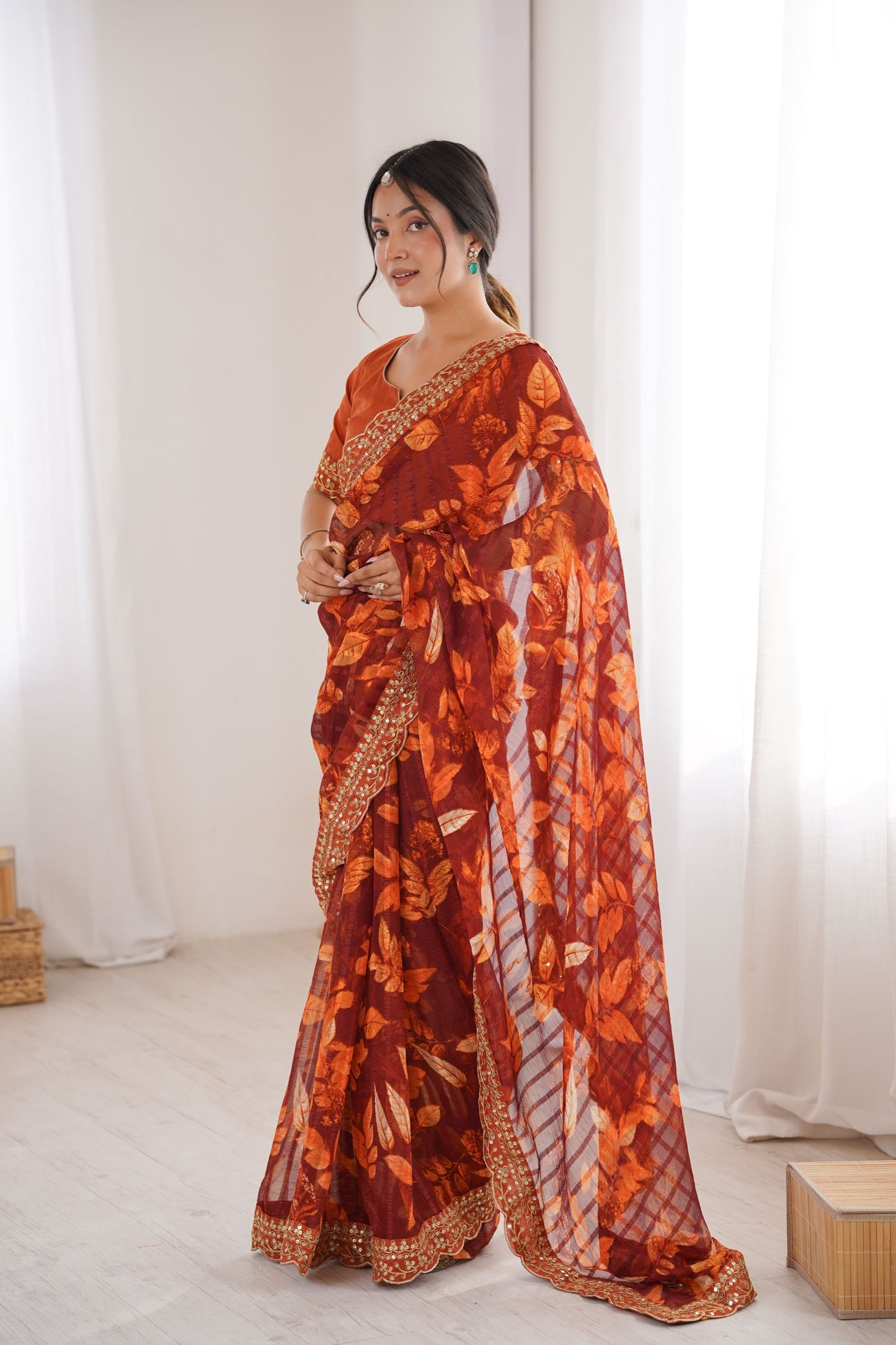 Rust Orange Georgette Leaf Print Saree with Golden Embroidered Border