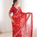 Red Georgette Leaf Print Saree with Golden Embroidered Border 