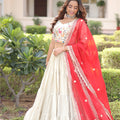 Graceful Off-White Embroidered Cosmos Silk Lehenga Choli with Red Dupatta for Wedding