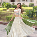 Fabulous Off-White Embroidered Cosmos Silk Lehenga Choli with Green Dupatta for Wedding