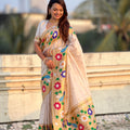 Cream Silk Saree with Multicolor Floral Peacock Motif Woven Border