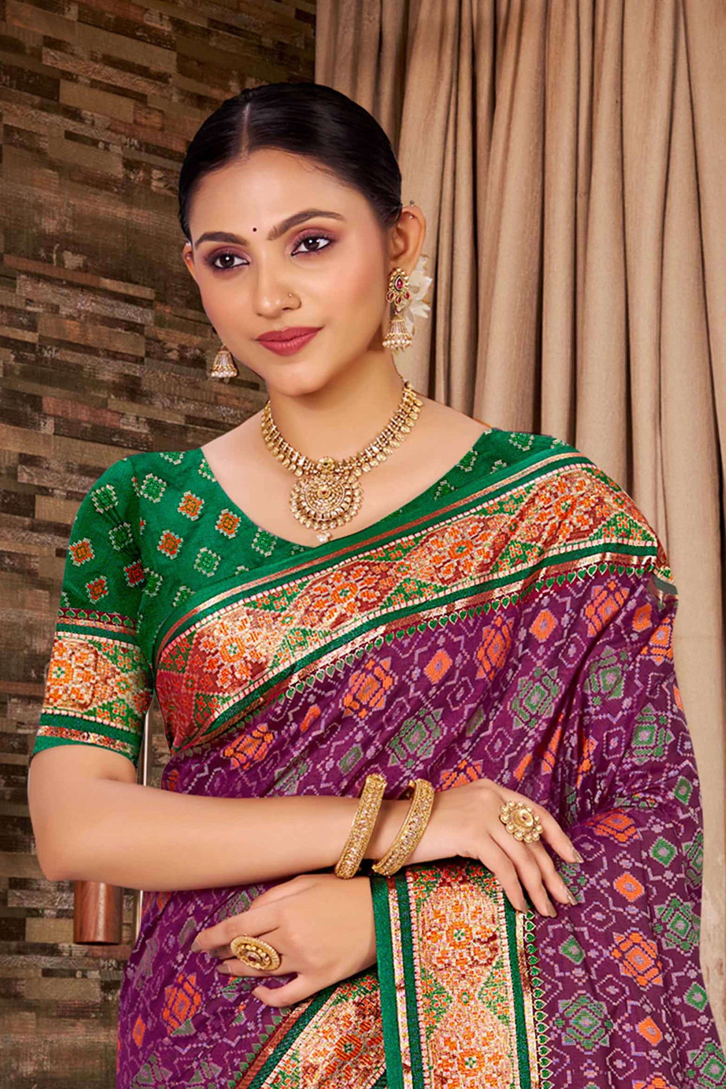 Purple Patola Silk Saree with Green Contrast Border Woven Design