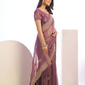 Mauve Embroidered Net Saree with Heavy Golden Border