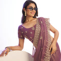 Mauve Embroidered Net Saree with Heavy Golden Border