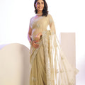 Beige Gold Embroidered Net Saree with Heavy Silver Border