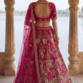 Glorious Rani Pink Heavy Embroidered Silk Bridal Lehenga Choli with Net Dupatta for Wedding