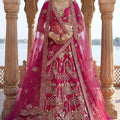 Glorious Rani Pink Heavy Embroidered Silk Bridal Lehenga Choli with Net Dupatta for Wedding