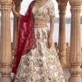 Stylish Off-White Heavy Embroidered Silk Bridal Lehenga Choli with Net Dupatta for Wedding