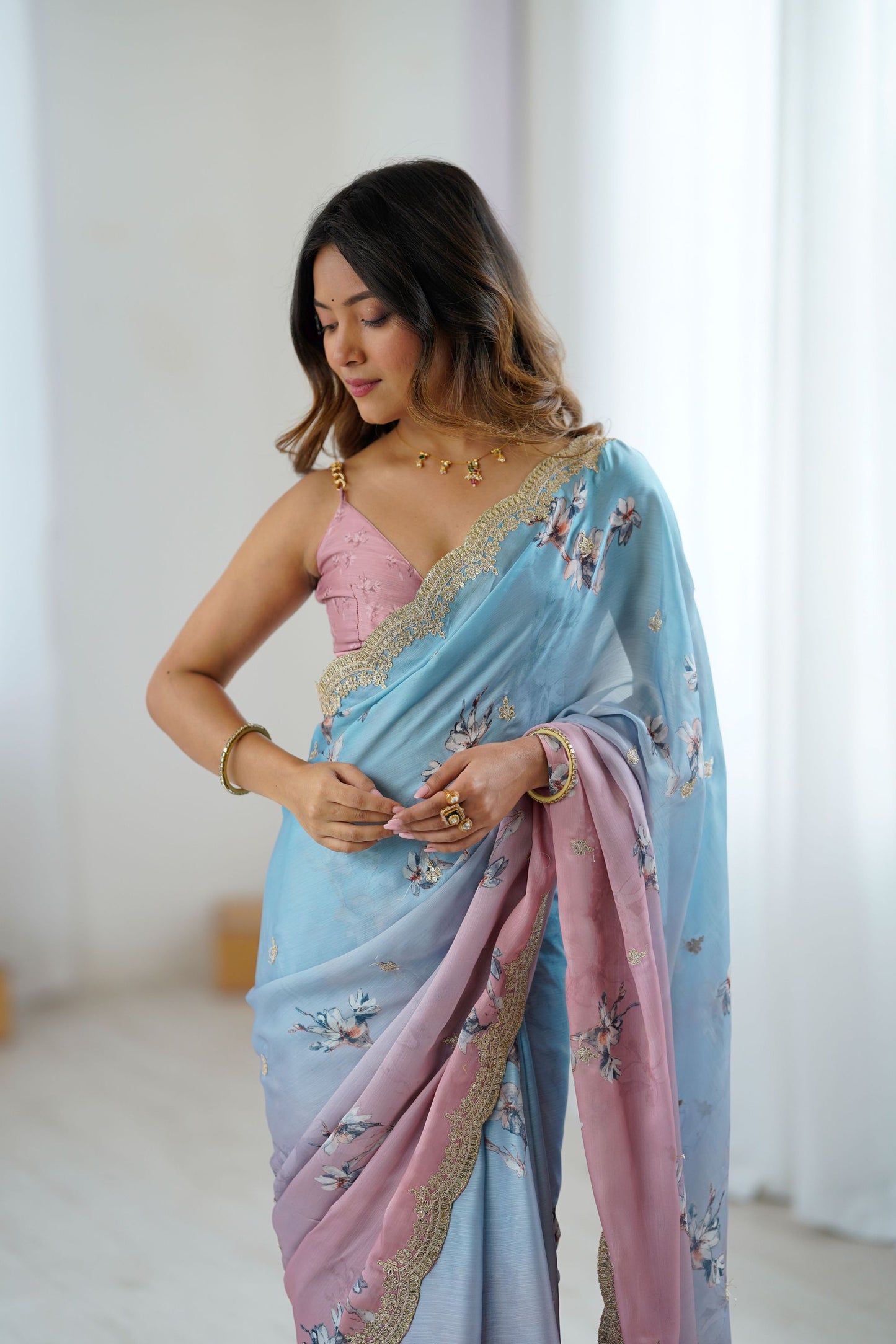 Pastel Pink Sky Blue Floral Organza Saree with Golden Lace Border