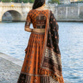 Graceful Rust Orange and Black Cotton Rayon Printed Lehenga Choli with Dupatta