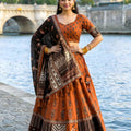 Graceful Rust Orange and Black Cotton Rayon Printed Lehenga Choli with Dupatta