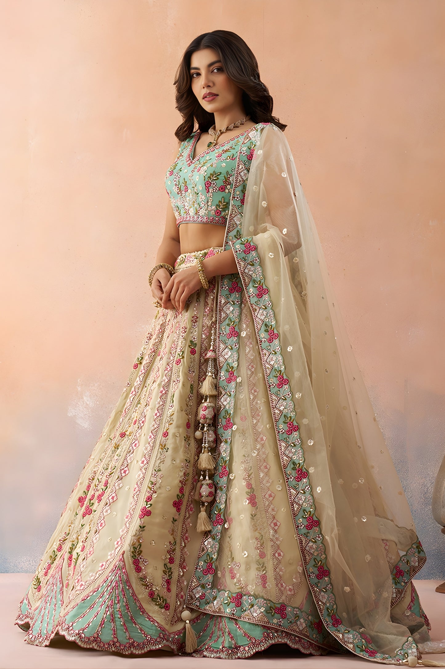 Stunning Cream Embroidered Lehenga Choli with Mint Green Blouse and Net Dupatta