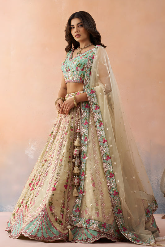 Stunning Cream Embroidered Lehenga Choli with Mint Green Blouse and Net Dupatta