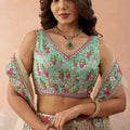 Stunning Cream Embroidered Lehenga Choli with Mint Green Blouse and Net Dupatta