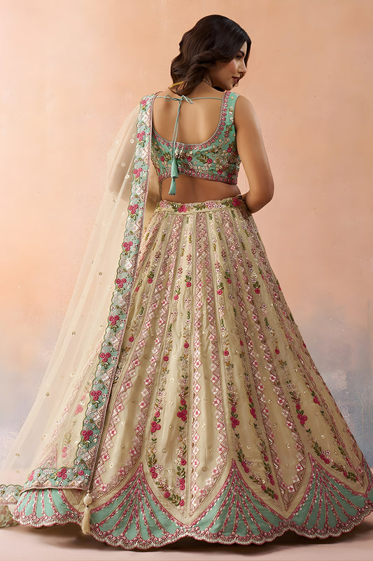 Stunning Cream Embroidered Lehenga Choli with Mint Green Blouse and Net Dupatta
