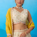 Luxury Cream Semi-Stitched Embroidered Lehenga Choli with Yellow Dupatta