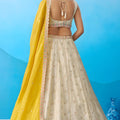 Luxury Cream Semi-Stitched Embroidered Lehenga Choli with Yellow Dupatta