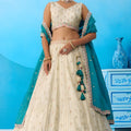 Traditional Cream Semi-Stitched Embroidered Lehenga Choli with Teal Green Dupatta