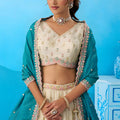 Traditional Cream Semi-Stitched Embroidered Lehenga Choli with Teal Green Dupatta