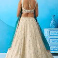 Traditional Cream Semi-Stitched Embroidered Lehenga Choli with Teal Green Dupatta