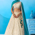 Traditional Cream Semi-Stitched Embroidered Lehenga Choli with Teal Green Dupatta