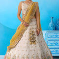 Amazing Cream Semi-Stitched Embroidered Lehenga Choli with Mustard Yellow Dupatta
