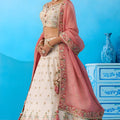 Lovable Cream Semi-Stitched Embroidered Lehenga Choli with Pink Dupatta