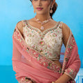 Lovable Cream Semi-Stitched Embroidered Lehenga Choli with Pink Dupatta