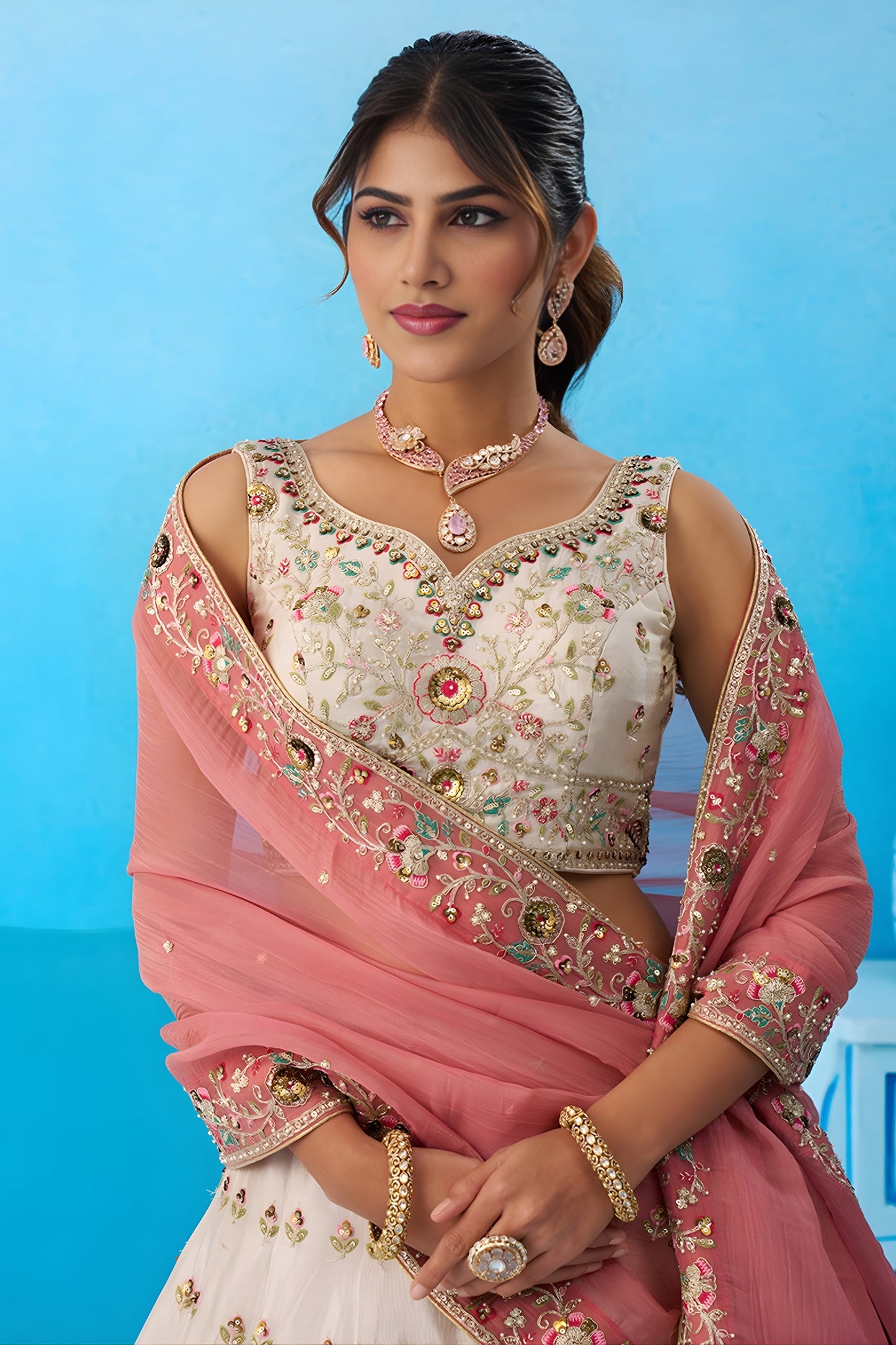 Lovable Cream Semi-Stitched Embroidered Lehenga Choli with Pink Dupatta
