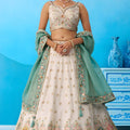 Beautiful Cream Semi-Stitched Embroidered Lehenga Choli with Sea Green Dupatta