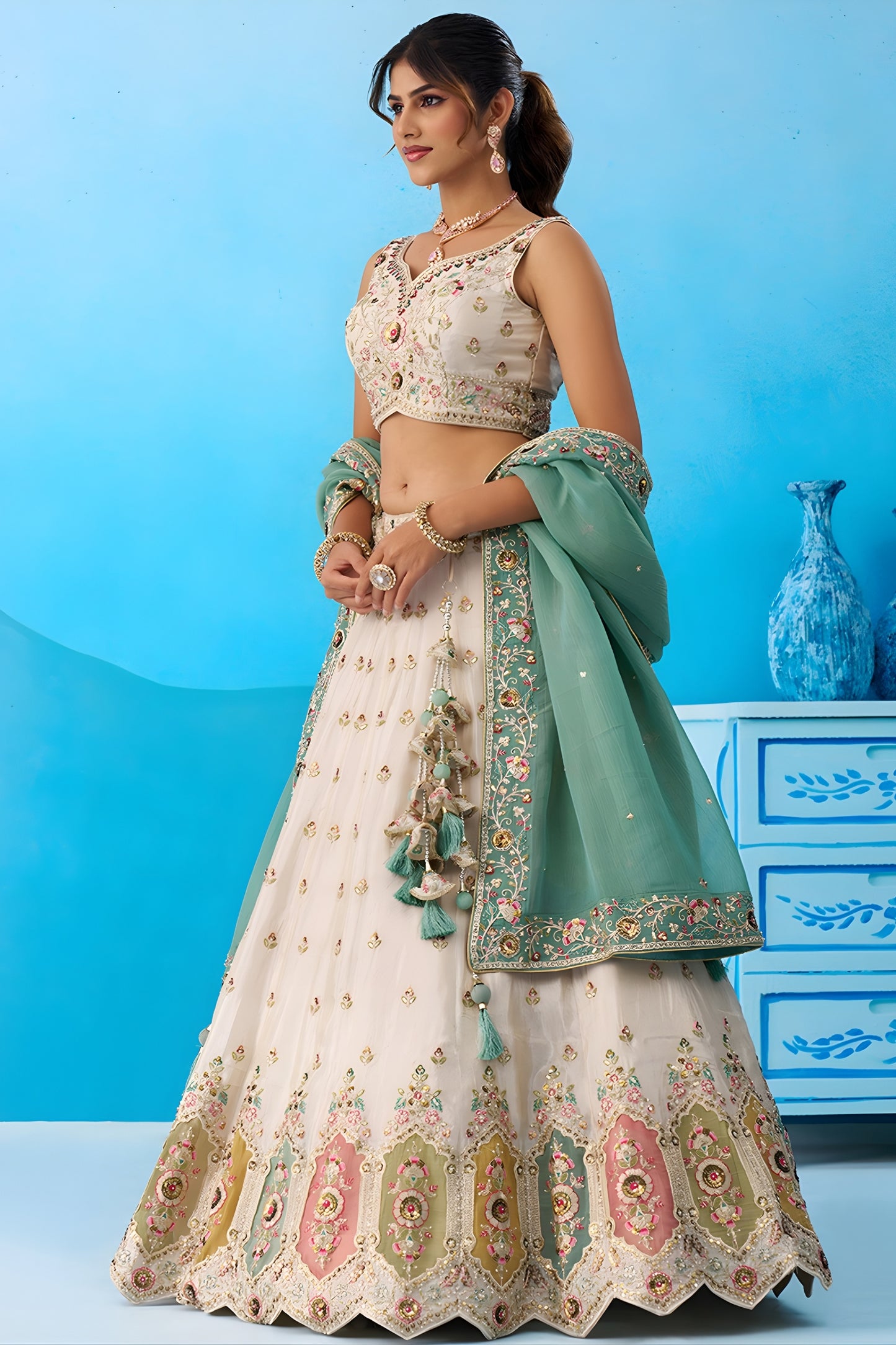 Beautiful Cream Semi-Stitched Embroidered Lehenga Choli with Sea Green Dupatta