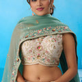 Beautiful Cream Semi-Stitched Embroidered Lehenga Choli with Sea Green Dupatta