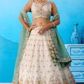 Beautiful Cream Semi-Stitched Embroidered Lehenga Choli with Sea Green Dupatta