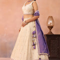 Elegant Cream Jacquard Silk Embroidered Lehenga Choli with Purple Dupatta