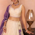 Elegant Cream Jacquard Silk Embroidered Lehenga Choli with Purple Dupatta