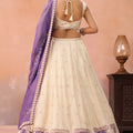 Elegant Cream Jacquard Silk Embroidered Lehenga Choli with Purple Dupatta