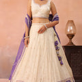 Elegant Cream Jacquard Silk Embroidered Lehenga Choli with Purple Dupatta
