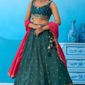Luxurious Dark Green Cosmos Silk Embroidered Lehenga Choli with Pink Dupatta