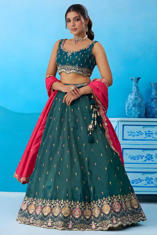 Luxurious Dark Green Cosmos Silk Embroidered Lehenga Choli with Pink Dupatta