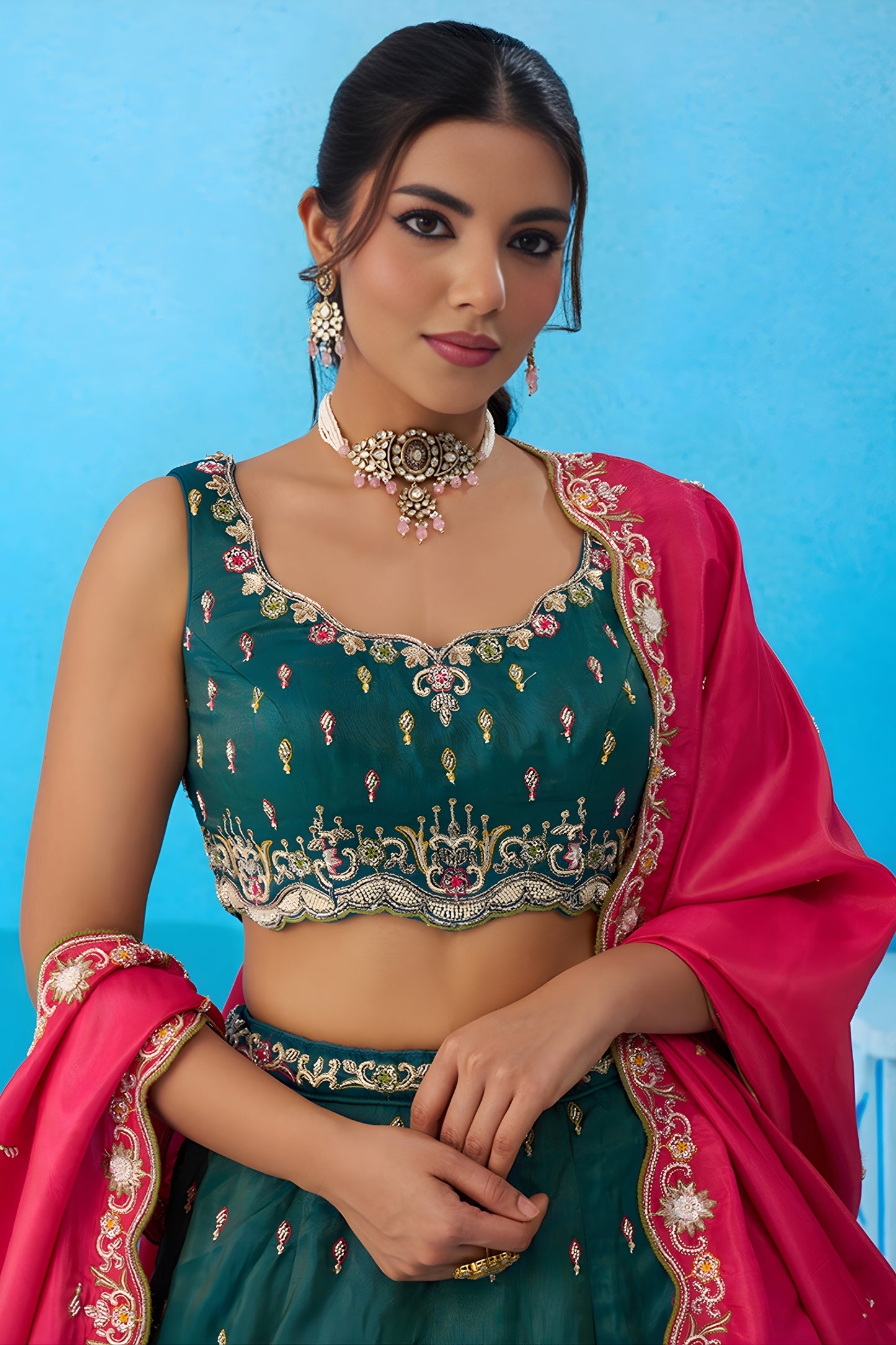 Luxurious Dark Green Cosmos Silk Embroidered Lehenga Choli with Pink Dupatta